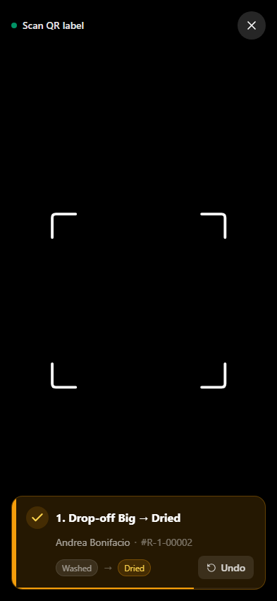 QR scanner showing a load advanced from Washed to Dried