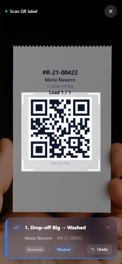 Scan result toast showing a load advanced from Received to Washed